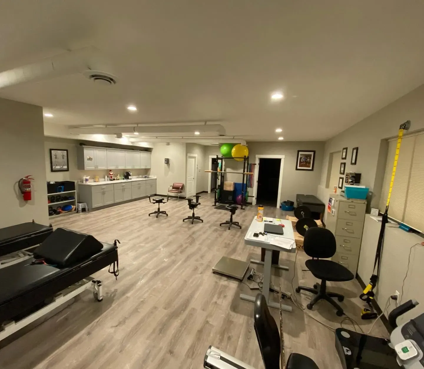 Open rehab gym at Columbia Valley Chiropractic Center with treatment tables and exercise equipment